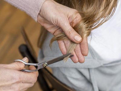 high-angle-woman-getting-haircut